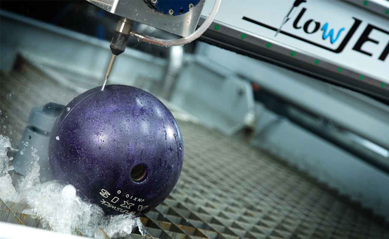 Water jet cutting a bowling ball