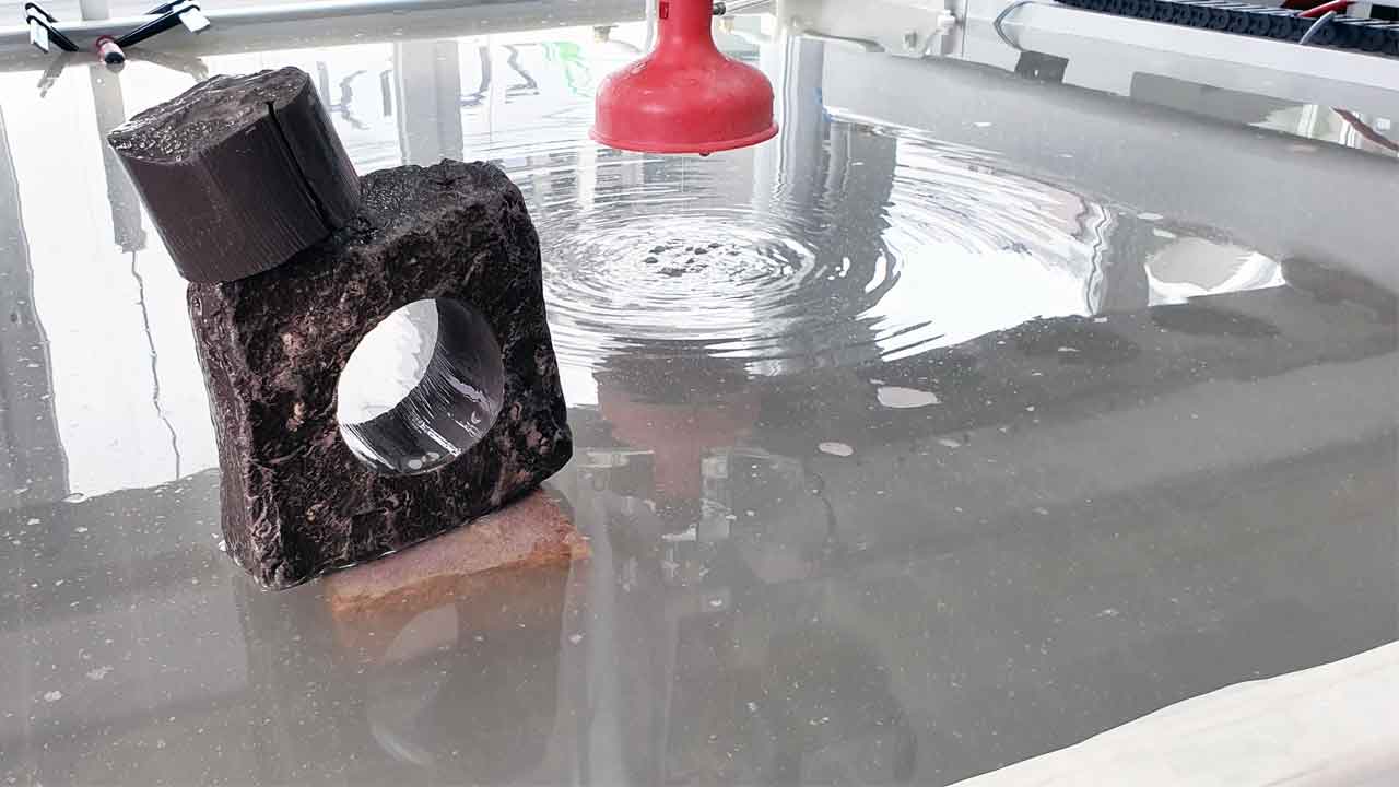 Water Jet cutting a natural stone with 60mm thickness